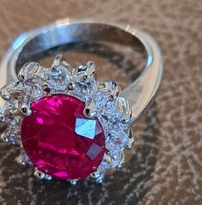 Elegant Silver Toned and Red Gemstone Ring With White Crystal Accents 0.232 Grms